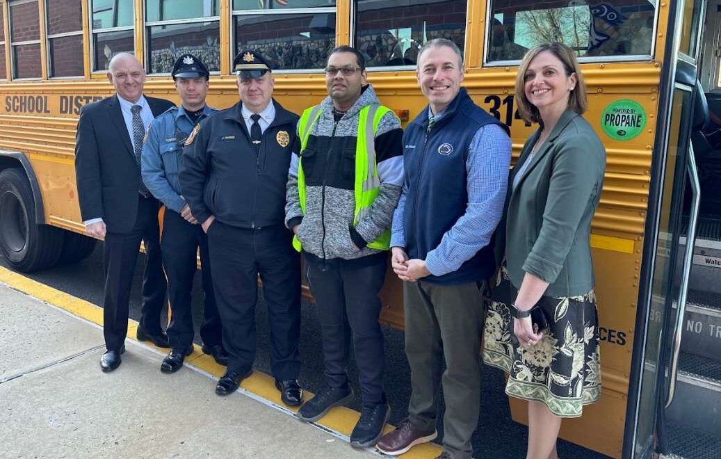 Greeting bus driver Arqam Ali, center in vest, Monday morning were, from left,  Council Rock Superintendent Andrew J. Sanko; Newtown Township police Officer Brandon Turpyn; Newtown Township Police Captain Jason Harris, Wrightstown Elementary School Principal Sam Smith and Council Rock Director of Elementary Education Nicole Crawford.