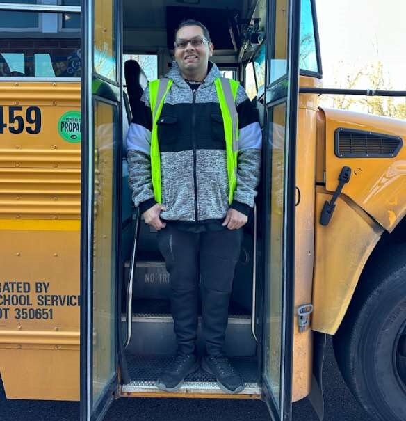 Arqam Ali, who drives a bus for Durham School Services, safely evacuated his vehicle Friday morning after it caught fire.