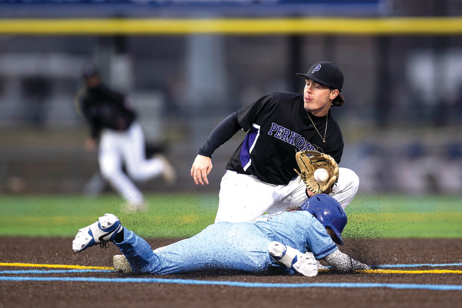 Perkiomen School’s Ryan Stubblefield fields a throw as Quakertown’s Danny Qualteria steals second base in the first inning.