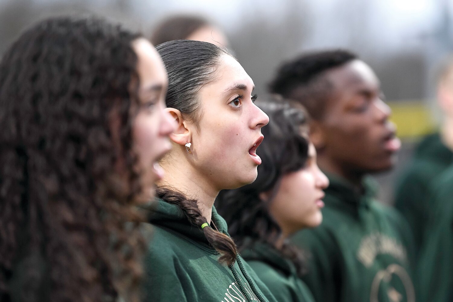 Senior Kamile Alicea sings the national anthem with others from the Quakertown Community High School Varsity Singers.