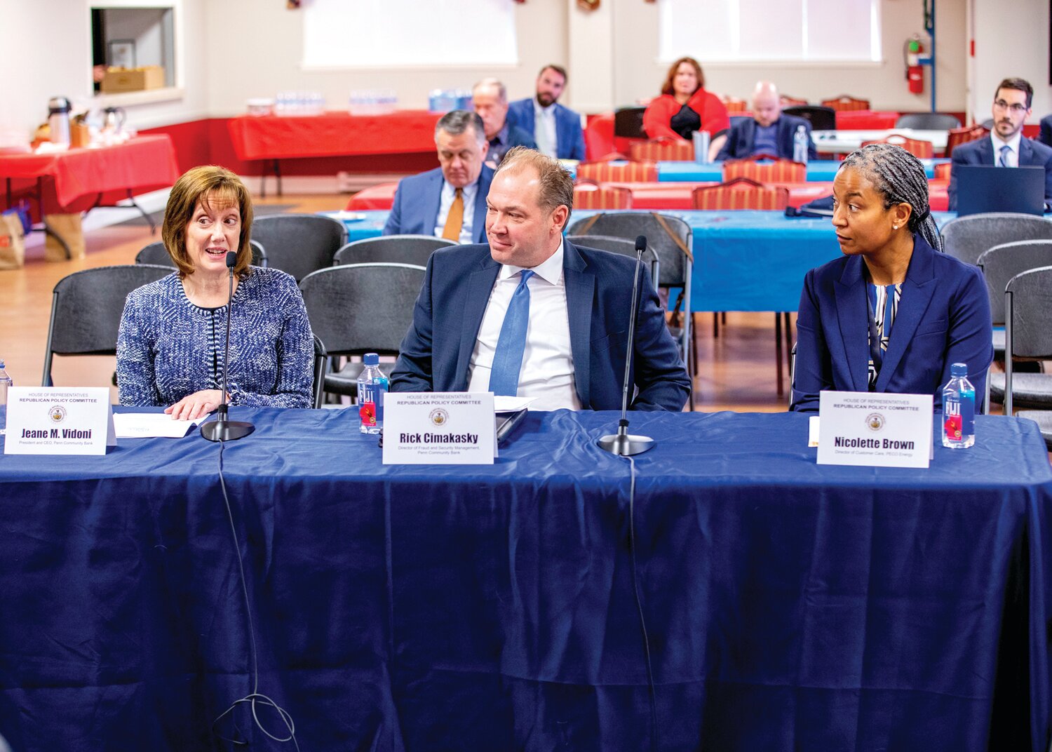 From left are Penn Community Bank’s Jeane Vidoni, president and CEO, and Rick Cimakasky, director of fraud and security management; and Nicolette Brown, PECO director of customer care, testifying at a PA House Field Hearing on fraud prevention.