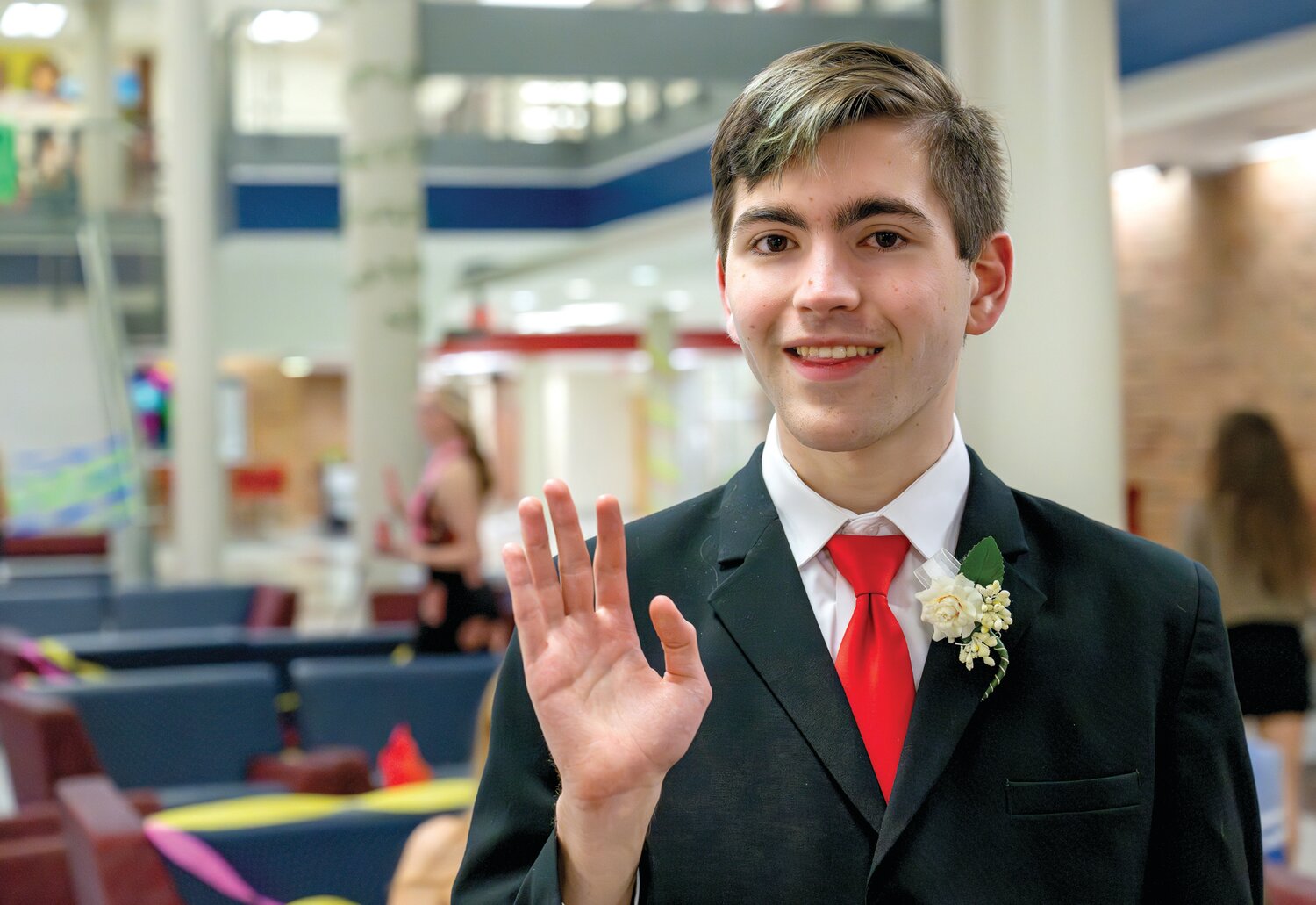 Charlie Reimer greets friends at Central Bucks East High School’s first Unified Prom.