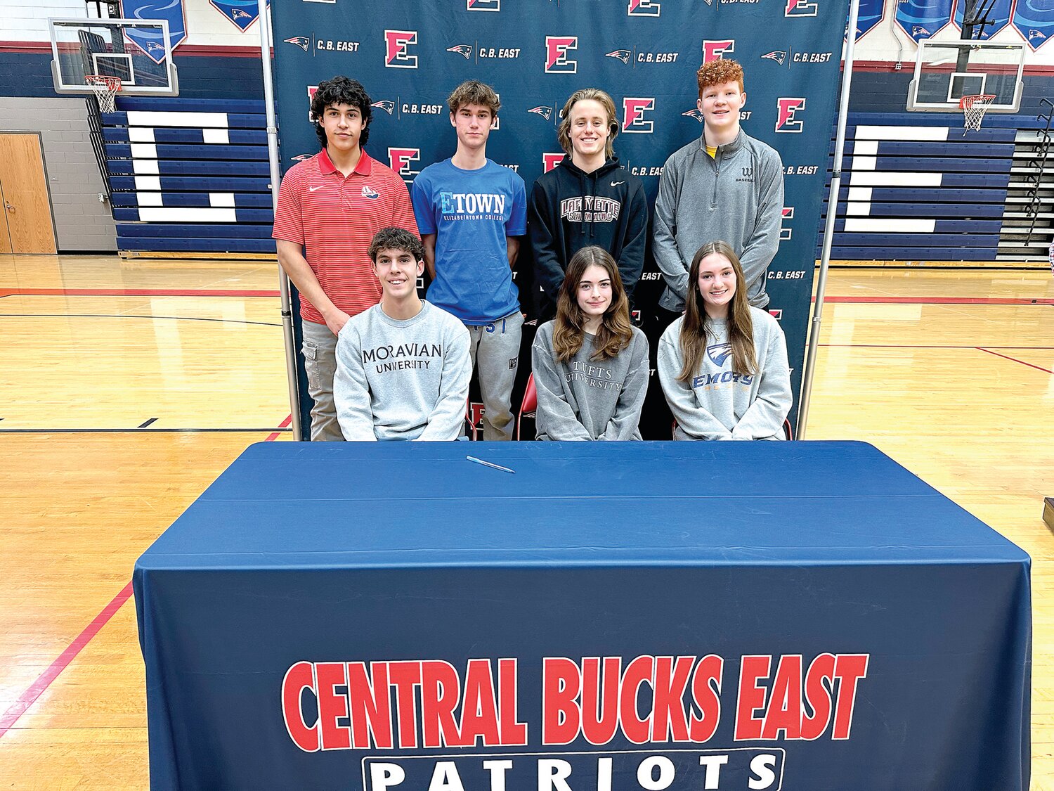 Central Bucks East recently recognized seven seniors for their commitment to compete in collegiate sports. From left are: front row, Joey Roth, Ava DePrizio, Melayna Pettigrew; back row, Thomas Cano-Piszel, Nick Raysky, Owen Lever and Damian Frayne.