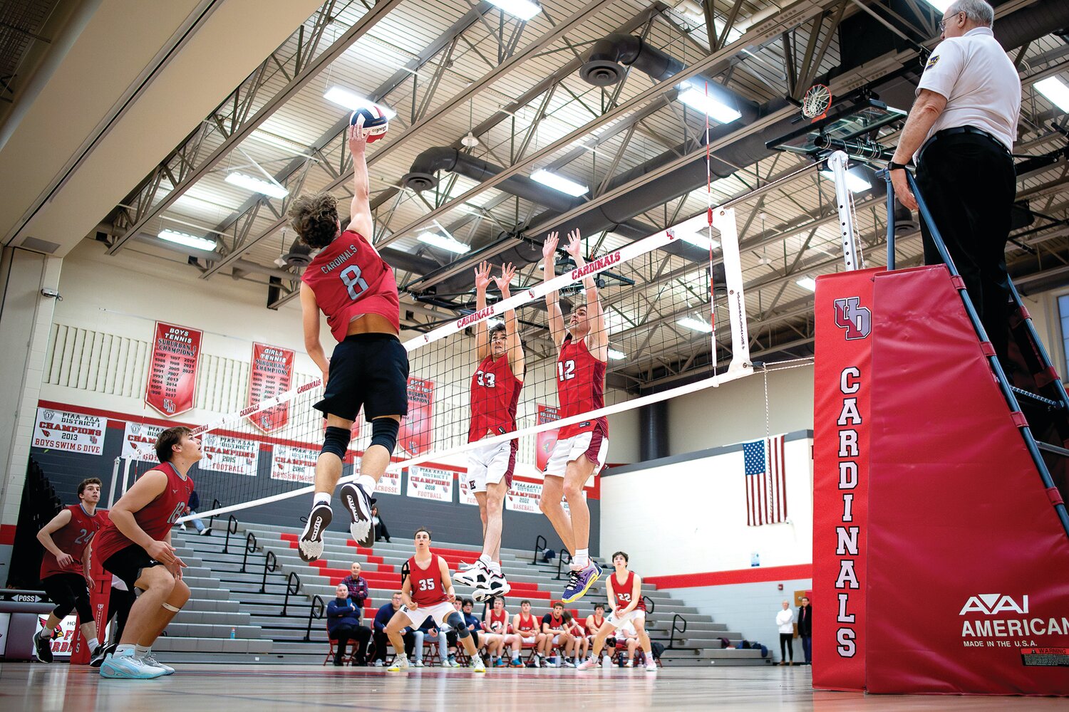 Central Bucks East’s Shane Sutton and AJ Helveston go up to attempt a block from Upper Dublin’s Ryan Stokes.