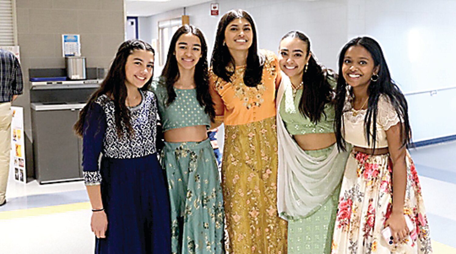 Students Maya Patel, Ava Bond, Arya Heble, Vienna Ajmeri and Jothika Amuth wear traditional Indian clothing, including salwars, lehengas and kurtis.