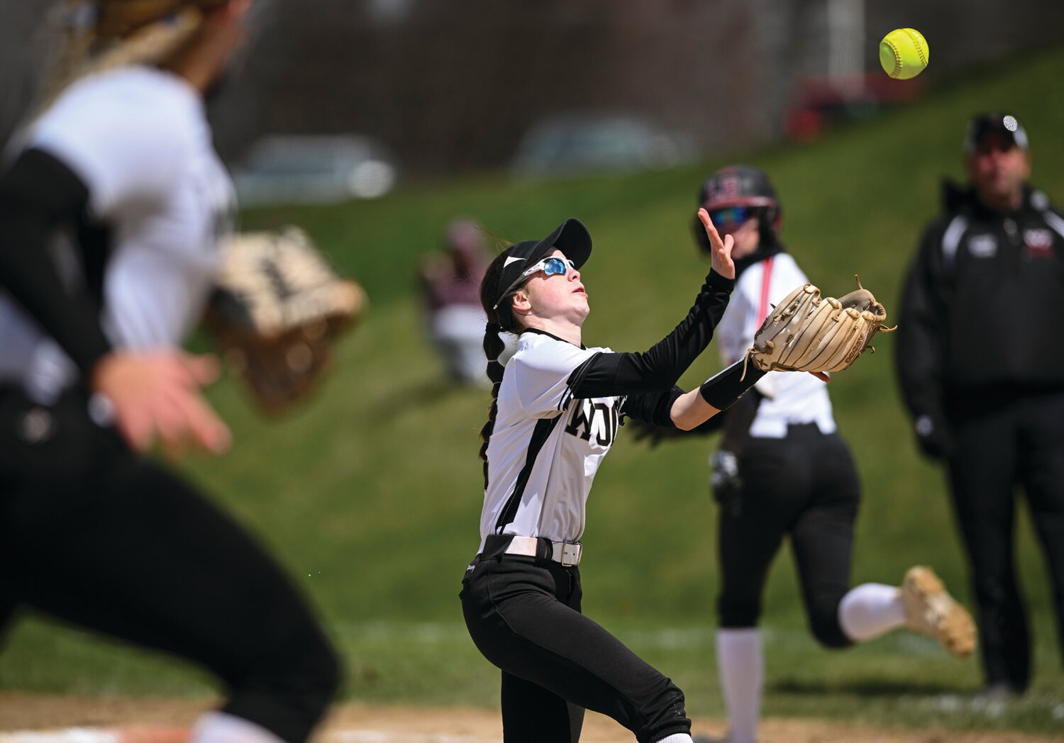 Archbishop Wood’s Maura Yoos catches an infield popup during the bottom of the fifth inning.