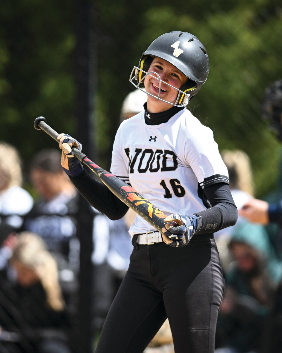 Archbishop Wood’s Maddison Conlon shares a laugh with Wood head coach Jackie Ecker during a fifth inning at-bat.