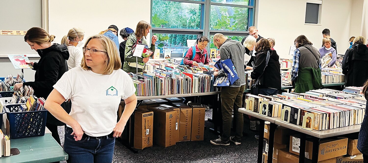 Book lovers pore over the selection offered at a prior Friends of the Doylestown Library Community Book Sale.