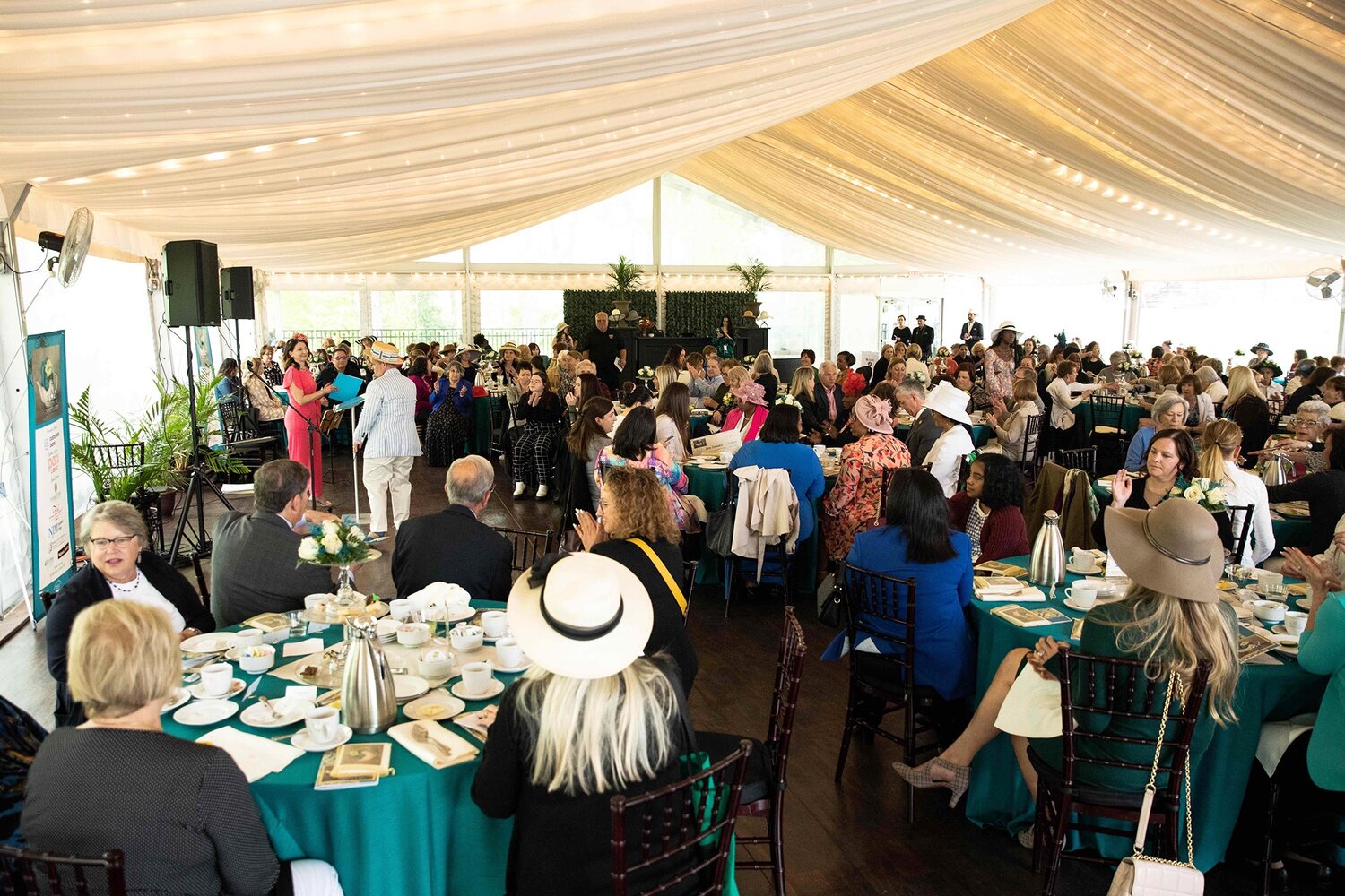 Guests, supporters and BCCC students gather under the Tyler Garden tent for the afternoon fundraising affair, Salute to Mothers Tea, in 2023.