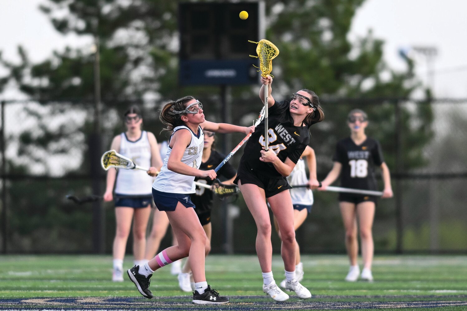 Central Bucks West’s Olivia Barrett gets the draw during a first quarter faceoff.
