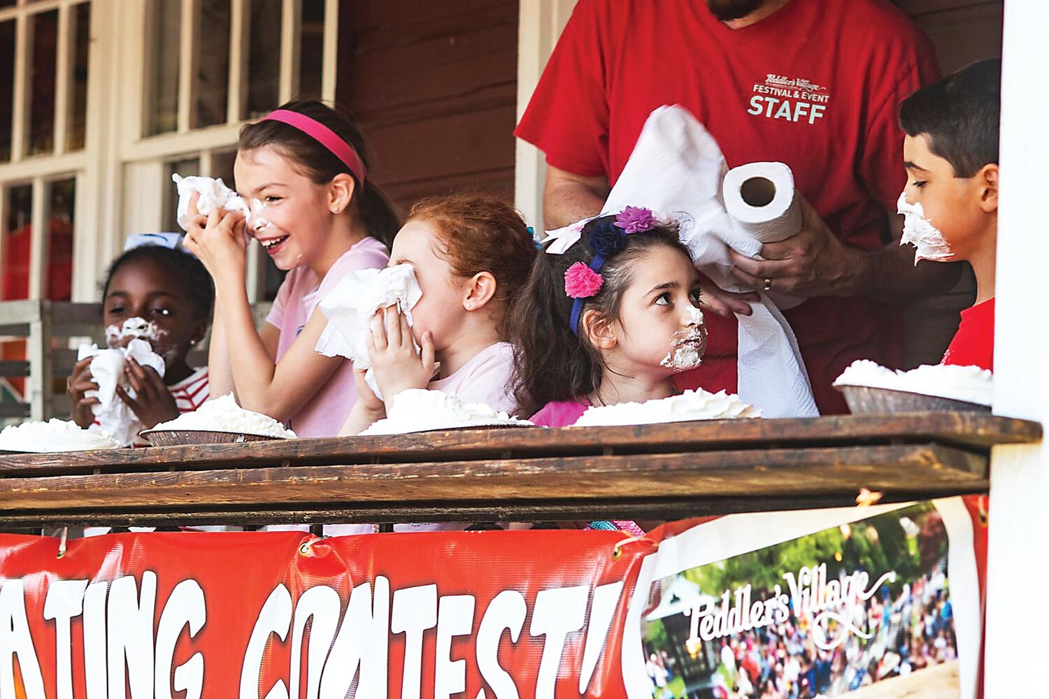 Children take part in a pie-eating contest at a previous Strawberry Festival at Peddler’s Village. The upcoming event includes contests for children and adults.