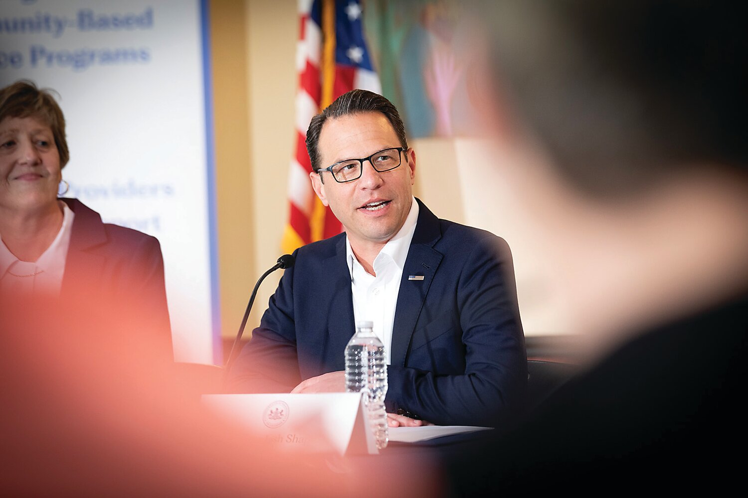 Governor Josh Shapiro speaks to Pennsylvanians with intellectual disabilities and autism, caretakers, and advocates at an April 17 roundtable discussion, as BARC Developmental Services Executive Director Mary Sautter looks on.