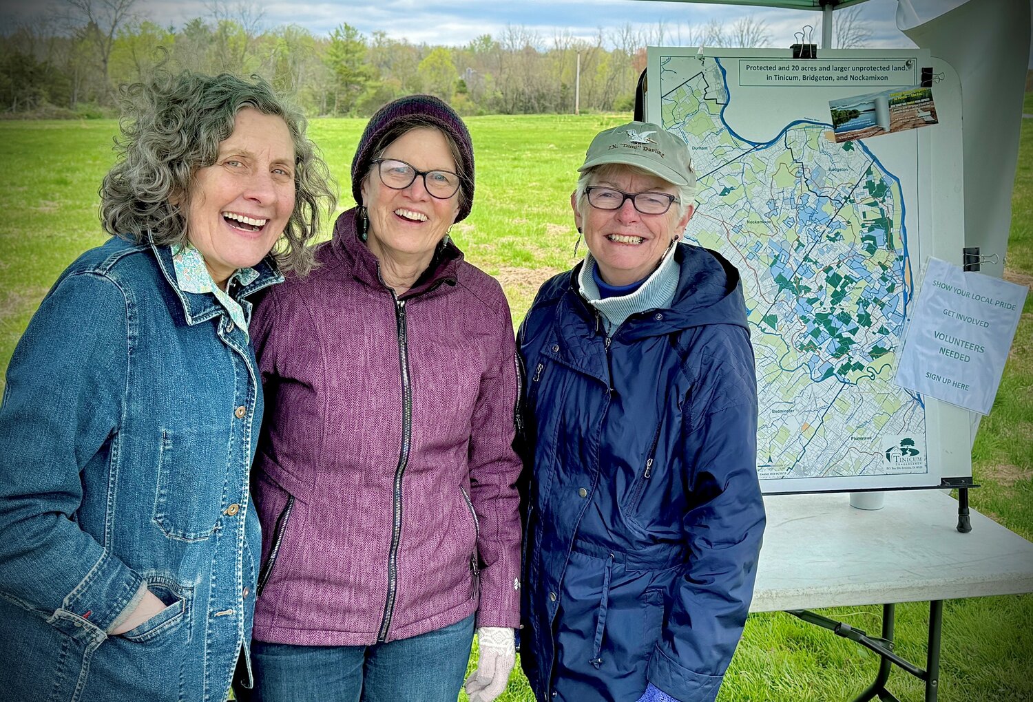Enjoying the Tinicum Earth Day Fair are, from left, EAC’s Cindi Gasparre, of the township’s Environmental Advisory Committee, Tinicum Conservancy volunteer Ros Cahill and Conservancy board of trustees member Peggy Enoch.