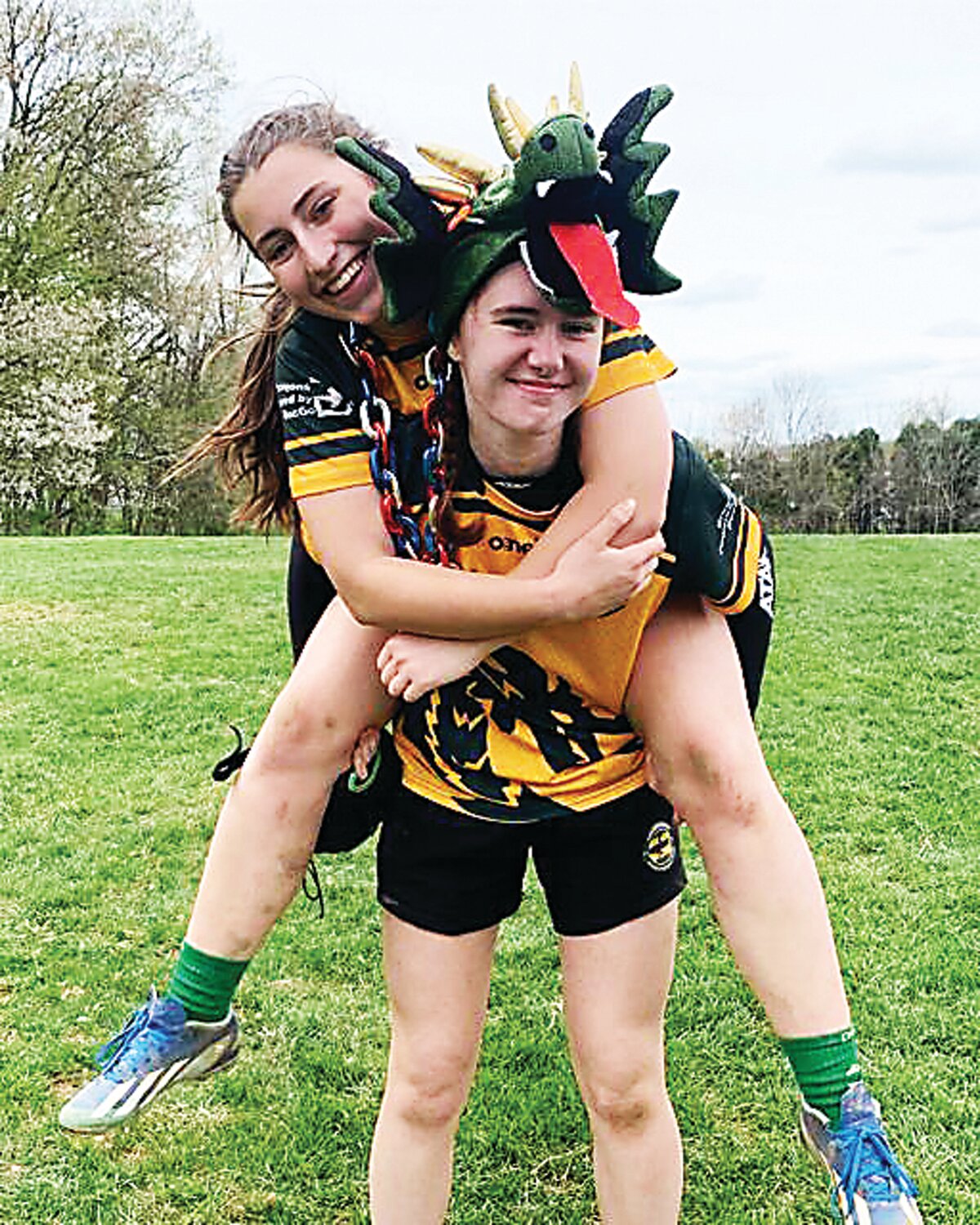 Doylestown Rugby high school girls player Nora Rosenburg, Player of the Match, in front, and Daisie Jurbala, Hit Chain Award winner, in the back.