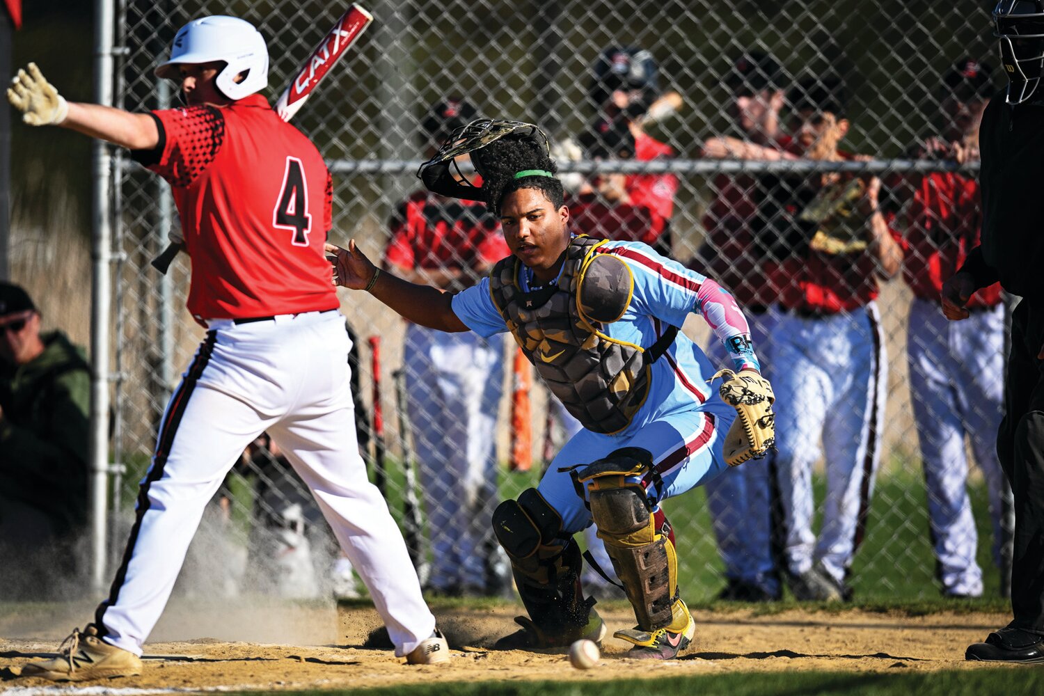 Faith Christian catcher Kendri Beltre gathers a wild pitch during the sixth inning.
