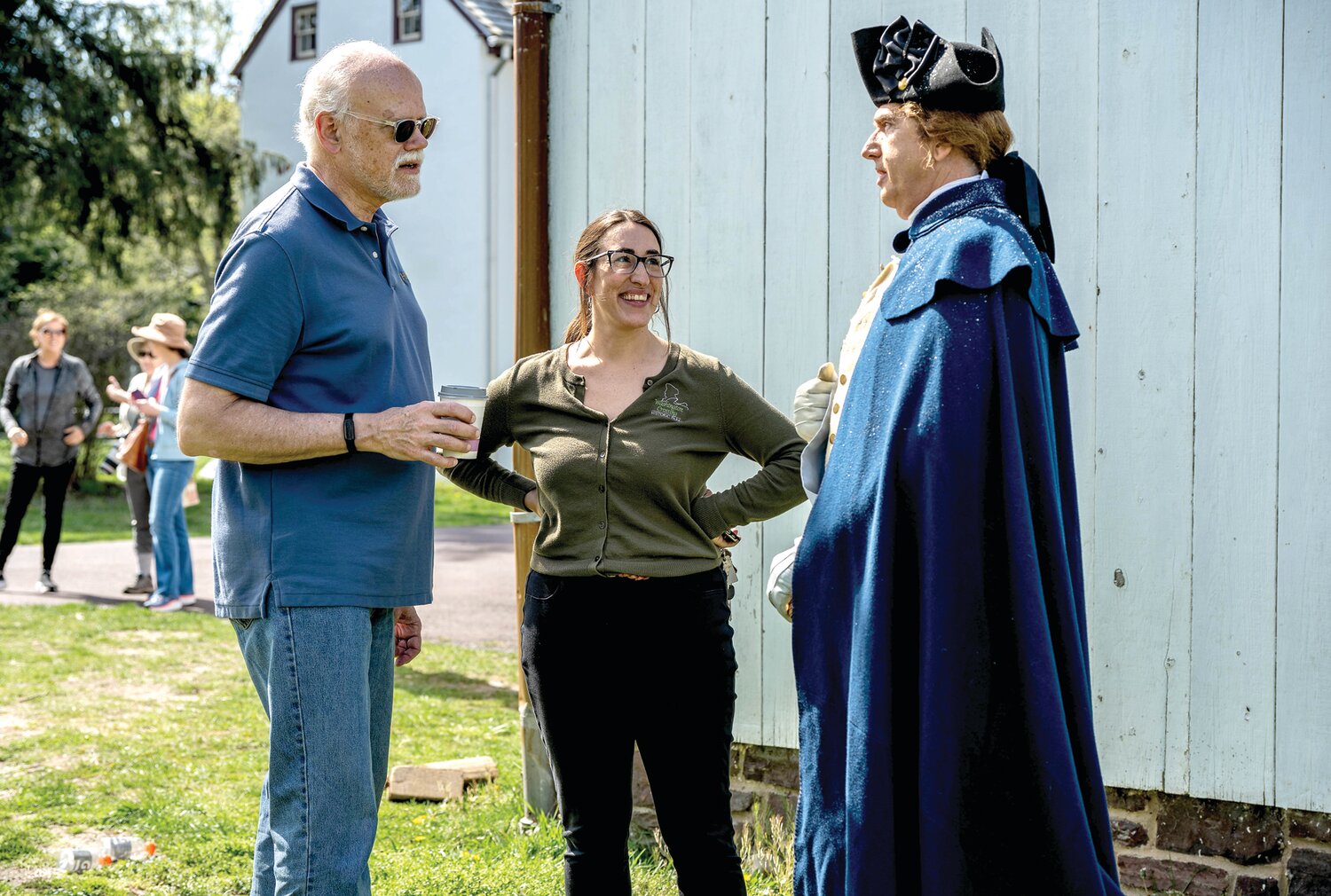 Jennifer Martin, executive director for the Friends of Washington Crossing Park, chats with executive producer Ralph Augstroze, left, and Daniel H.T. Shippey, who plays George Washington.