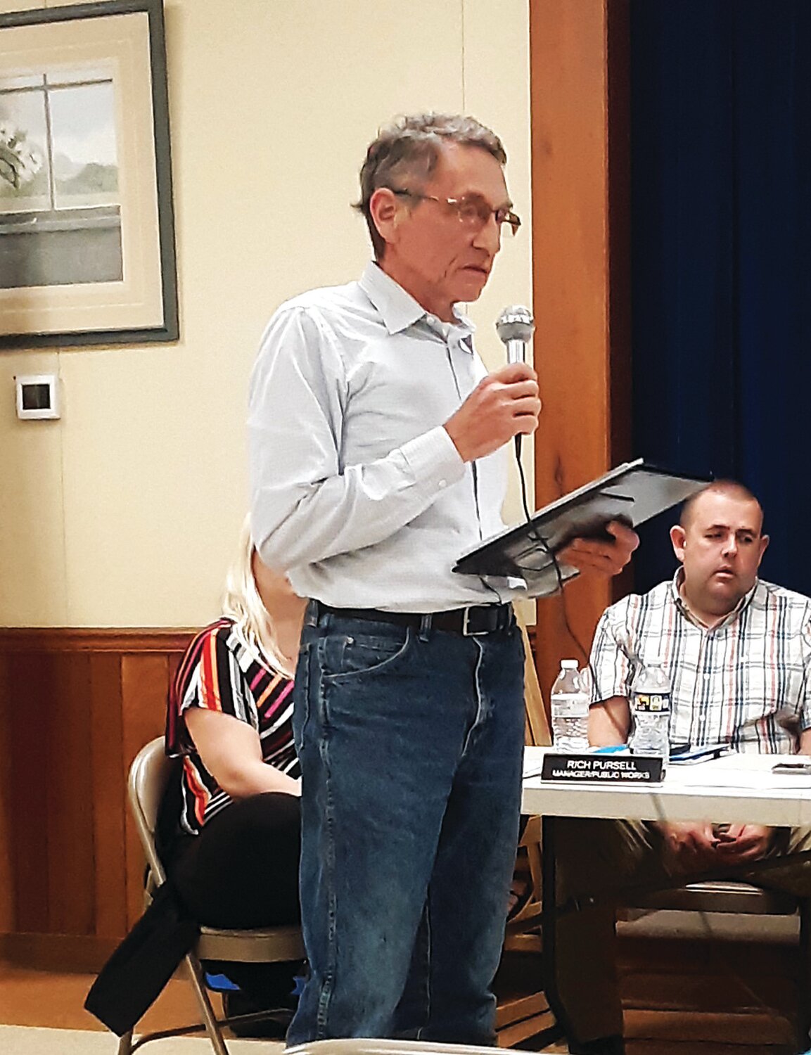 Expansion opponent Bill Buriak asks camp director Dave Stiansen how the shooting ranges will be monitored and maintained. Residents have expressed concern about stray bullets and the possibility of lead from spent bullets entering the soil and groundwater.