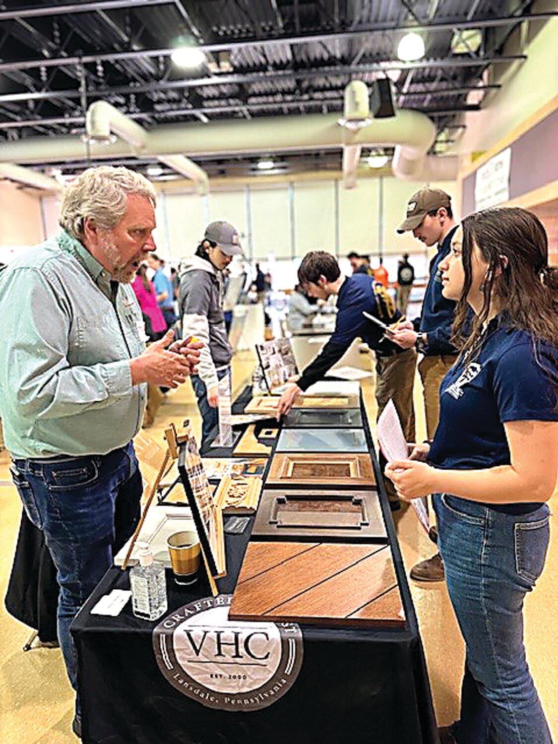 Middle Bucks Institute of Technology student Sue Suber, right, attends a career fair hosted by MBIT and the Home Builders Association of Bucks and Montgomery Counties.