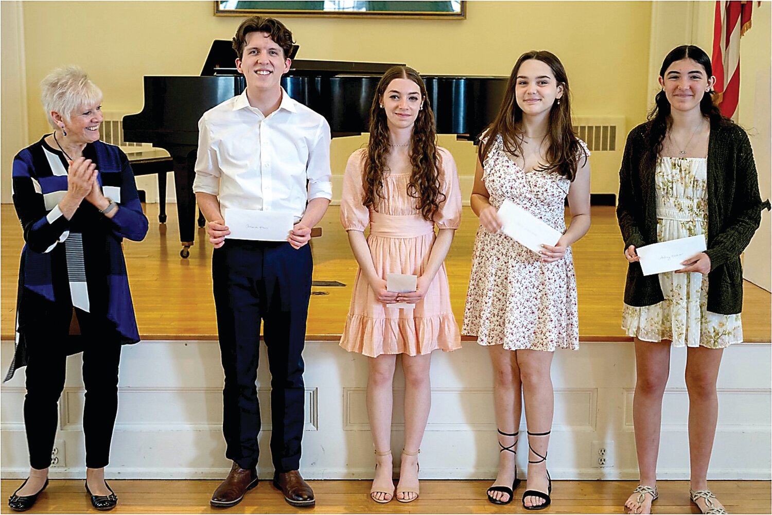 Voices of the Future finalists with BCCS Assistant Conductor Susan Johnson are, from left, Cameron Krauss, Helena Badiali, Olivia Giampolo, and Audrey Gaona.