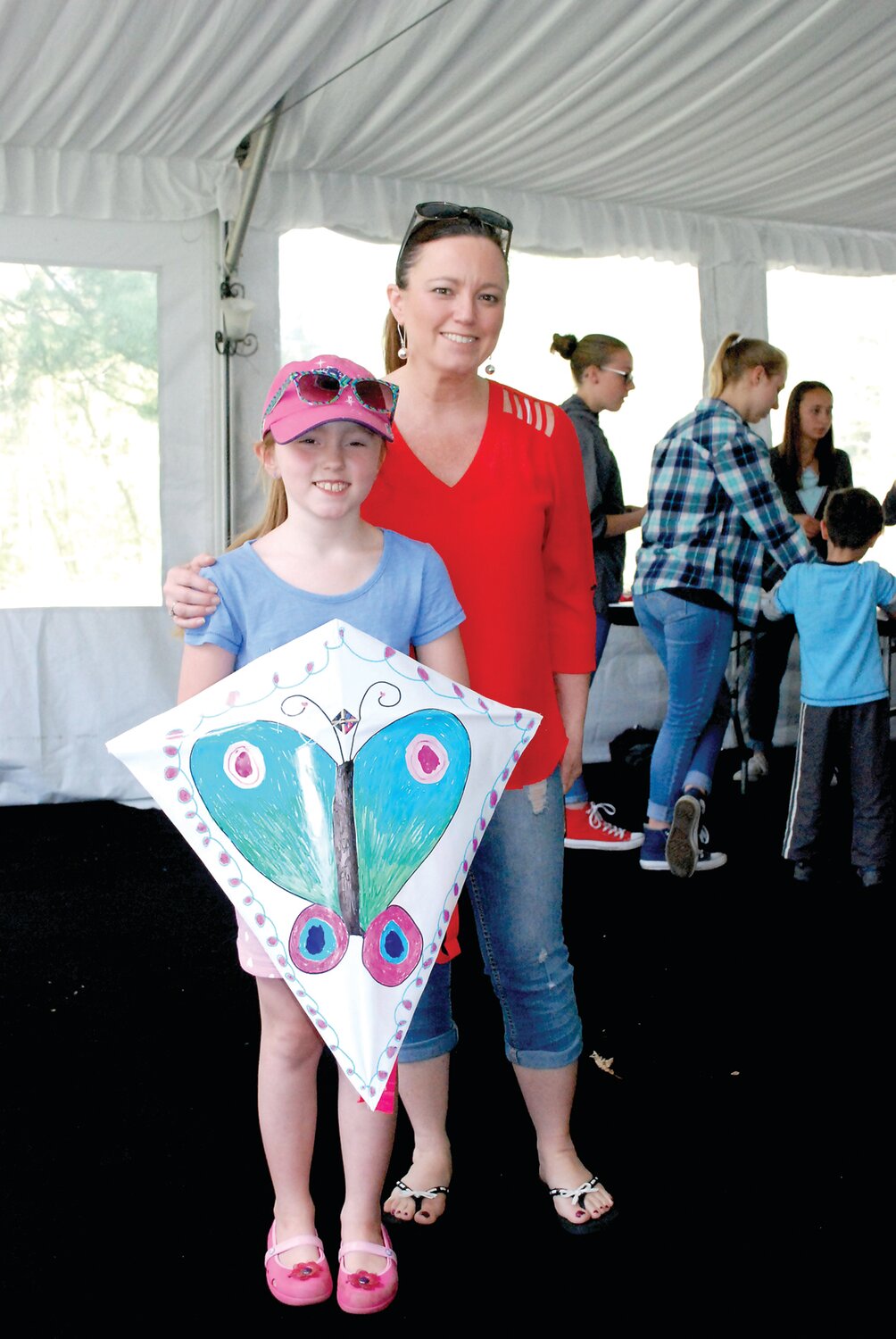 A child holds the kite she created during a previous Kite Day at Mercer Museum in Doylestown.