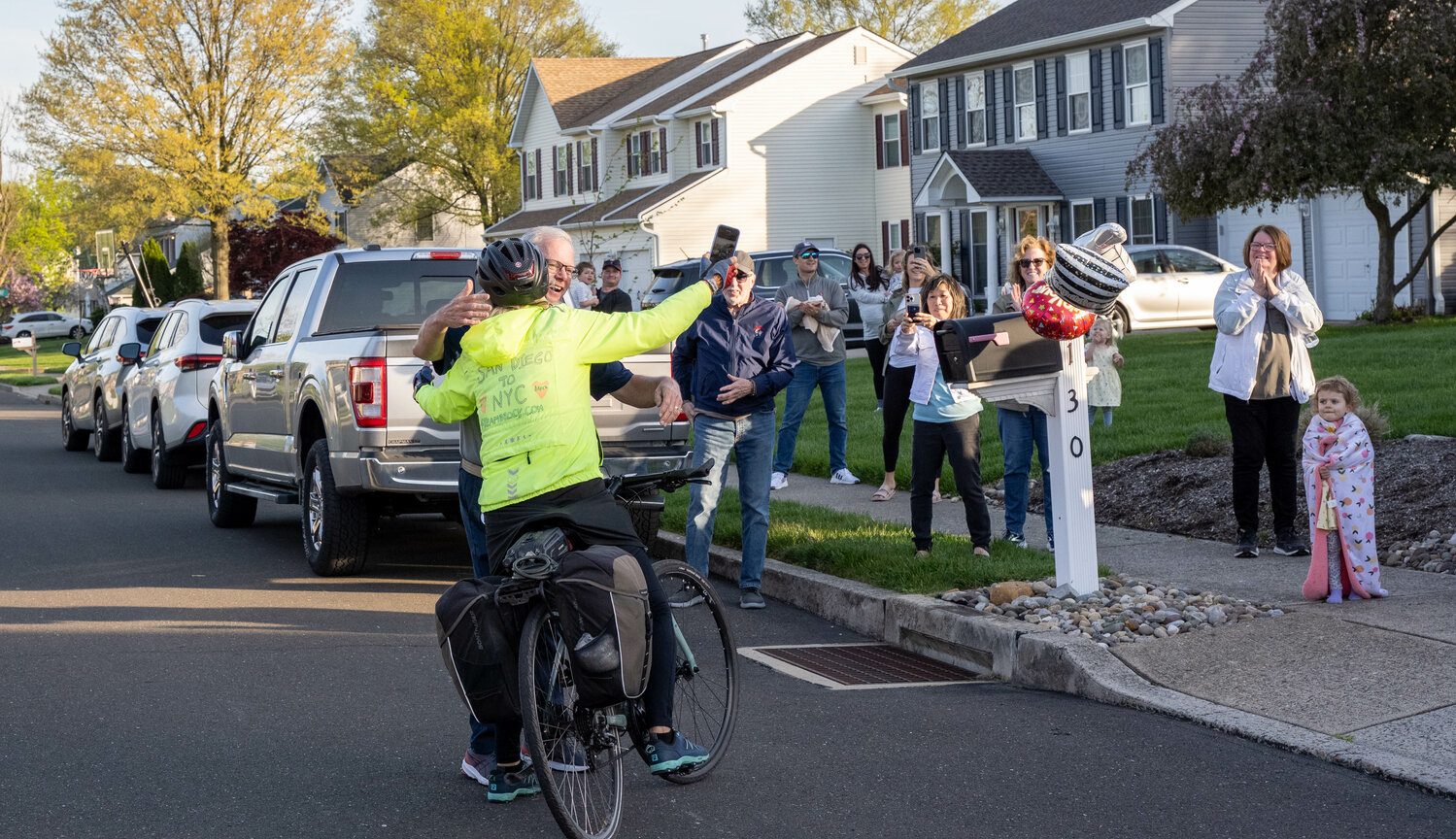 Wayne Tallman, of Falls, greets his sister Debbie Tallman Curtis as she arrives at his home. Curtis traveled across on her bike to raise awareness for mental health issues.