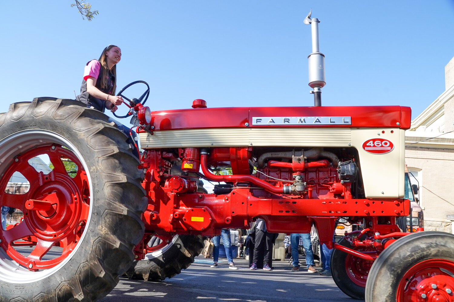 A participant in the A-Day tractor parade gets in gear for the event.
