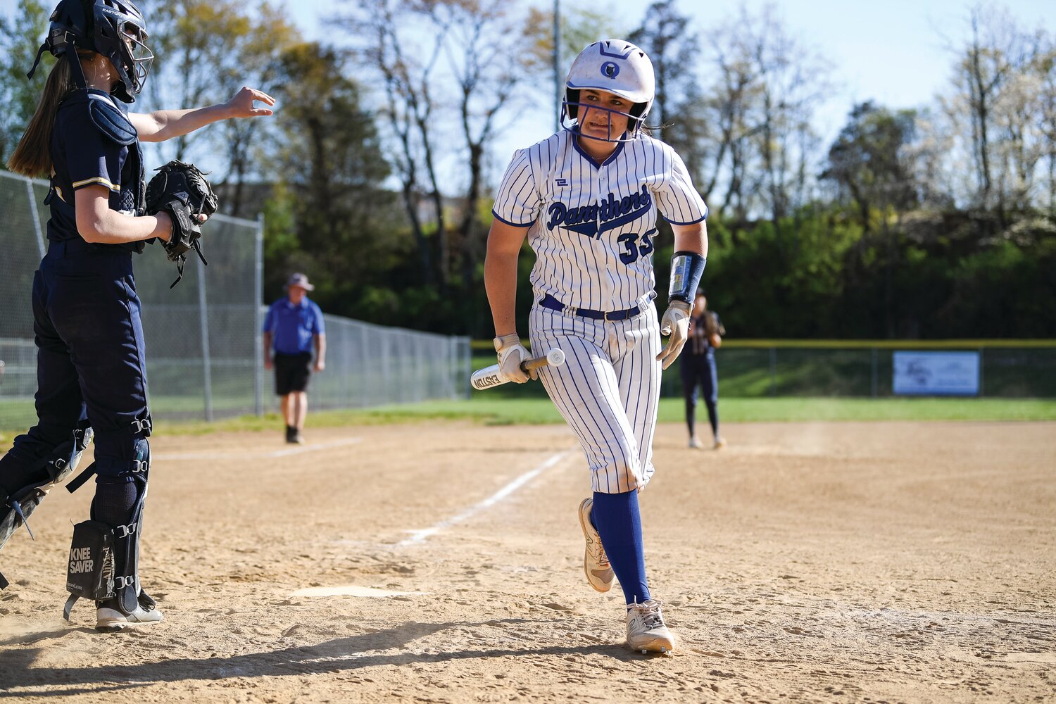 Quakertown’s Ellie Hilton grimaces after a tight pitch in the sixth inning.