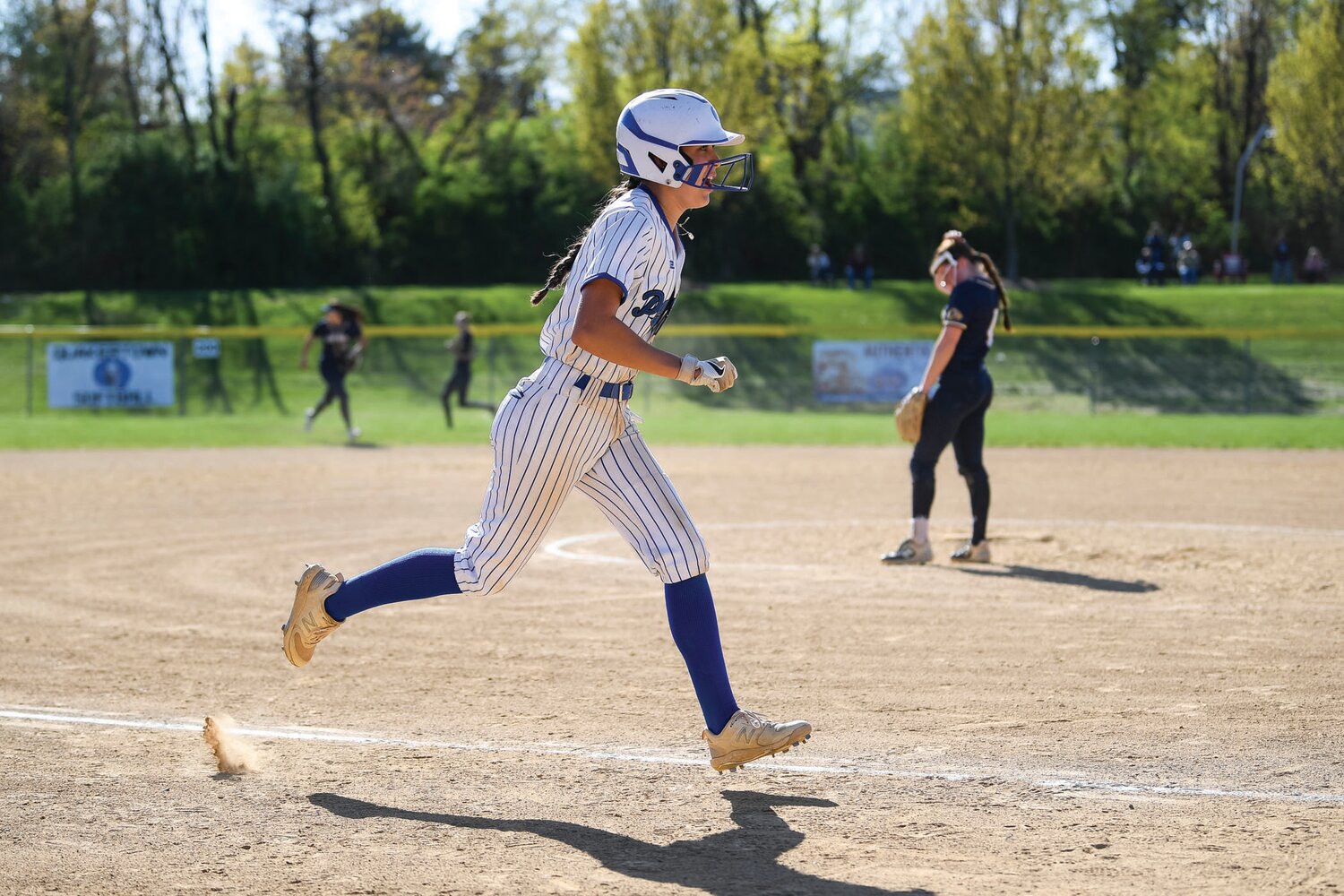 Quakertown’s Kira Jefferson trots home after a base hit made it 11-5 in the sixth inning.