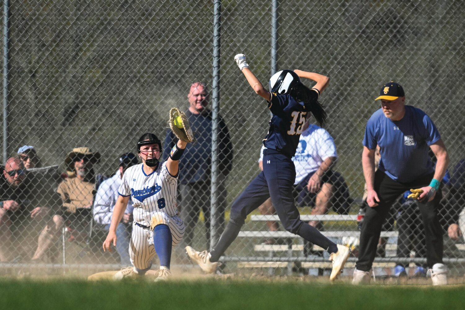 Quakertown’s Leah Schwalm fields a throw to just get New Hope-Solebury’s Izzy Elizondo in the third inning.