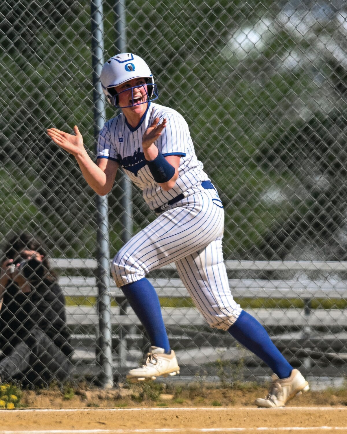 Quakertown’s Mary Wilkinson scores in the first inning.