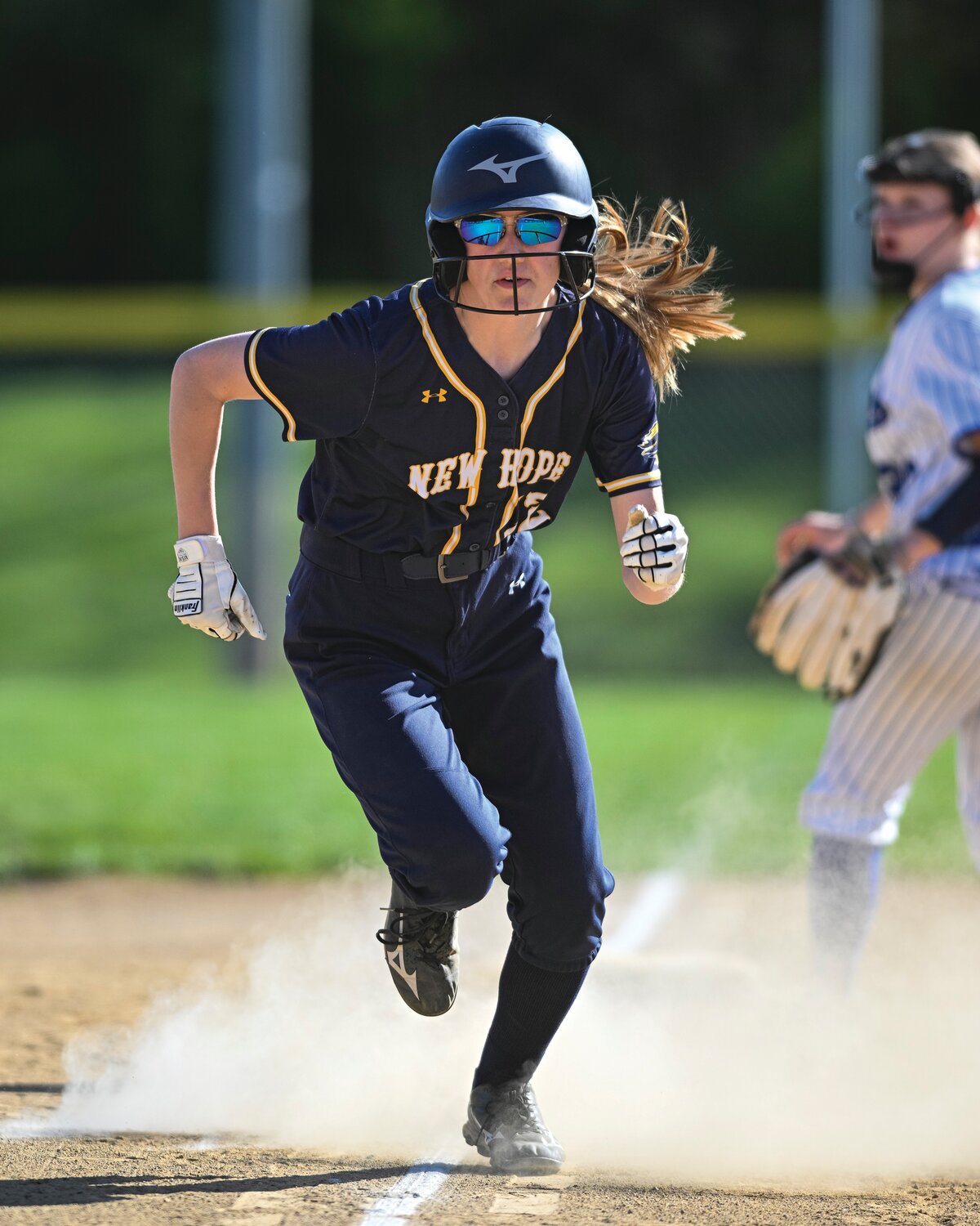 New Hope-Solebury’s Kaylee Harris sprints home with the Lions’ fourth run in the fifth inning.