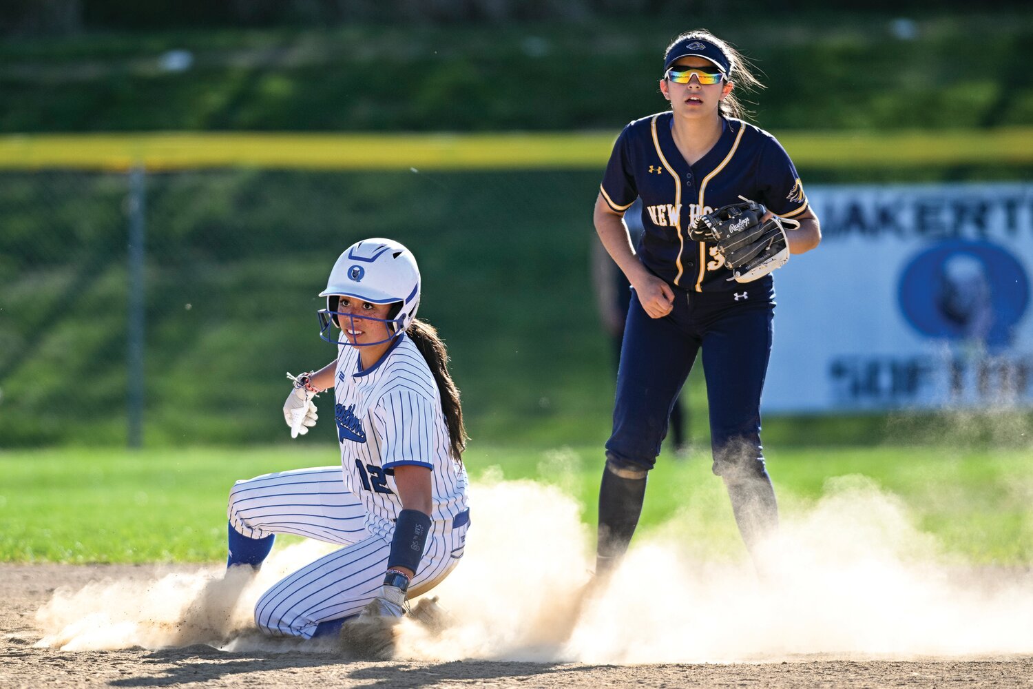 Cadence Lewis watches the throw as she steals second base in the bottom of the sixth inning.