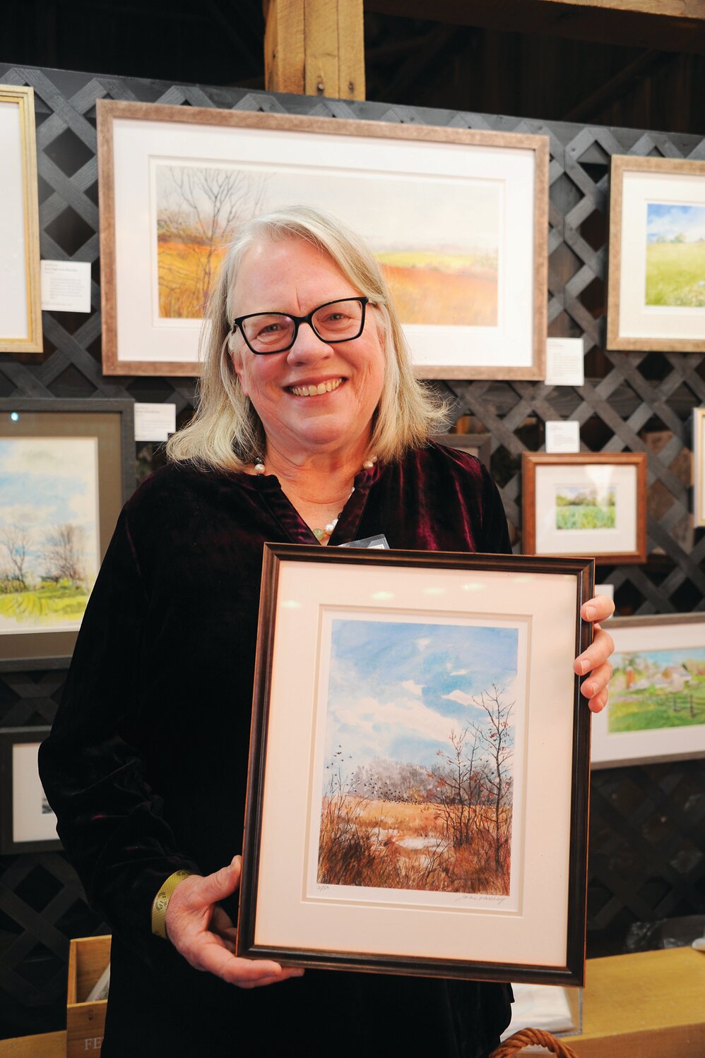 Jane Ramsey displays her paintings.