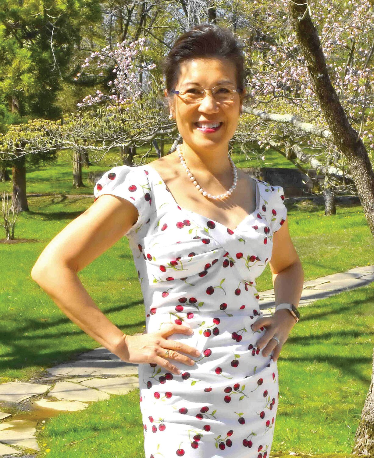 Guest Judy Chang Cody wears attire that keeps with the cherry blossom theme.