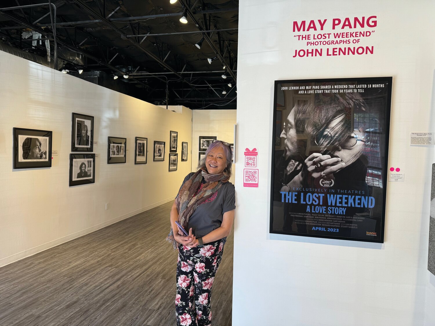May Pang stand with her photographic exhibition.