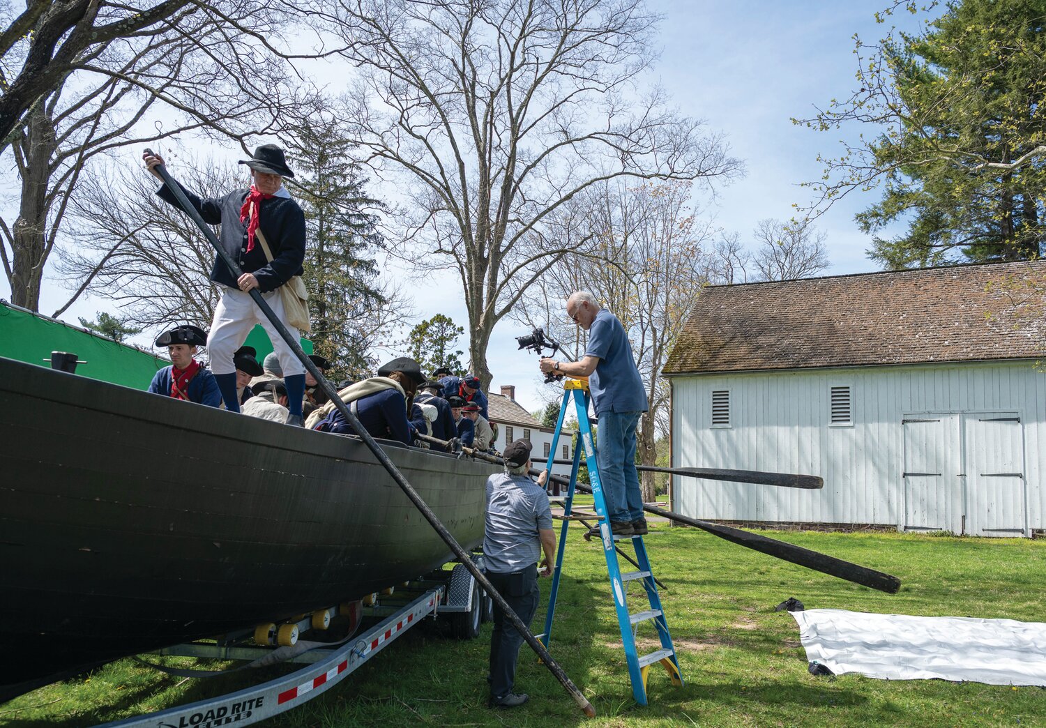 Ralf W. Augstroze climbs a ladder and eyes the action on the Durham boat during a recent shoot at Washington Crossing Historic Park.