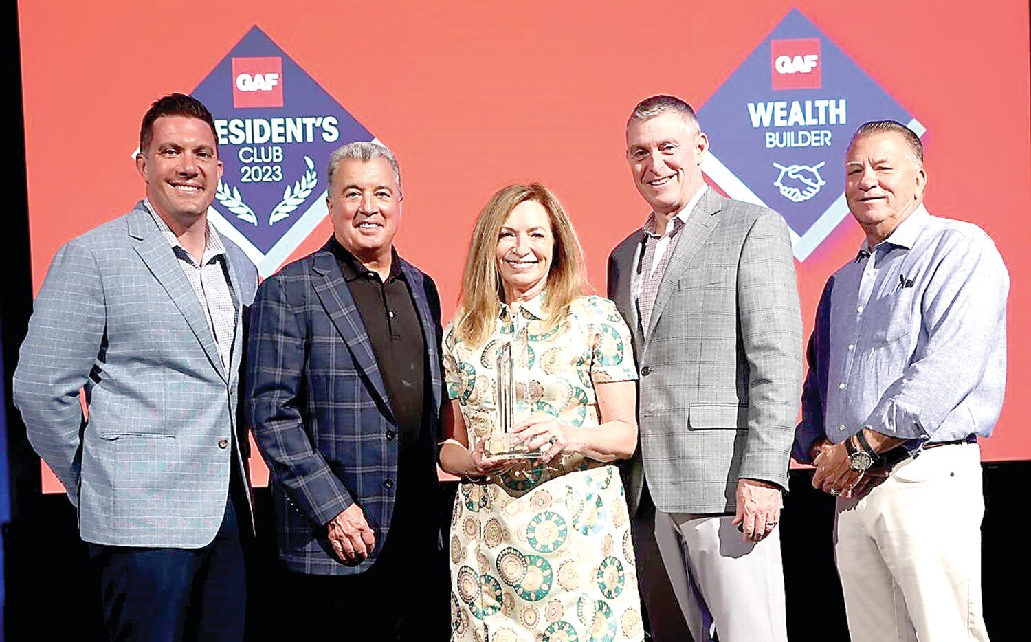 Melissa Eiseman, center, receives a GAF 3-Star President’s Club Award given to Eiseman Construction.