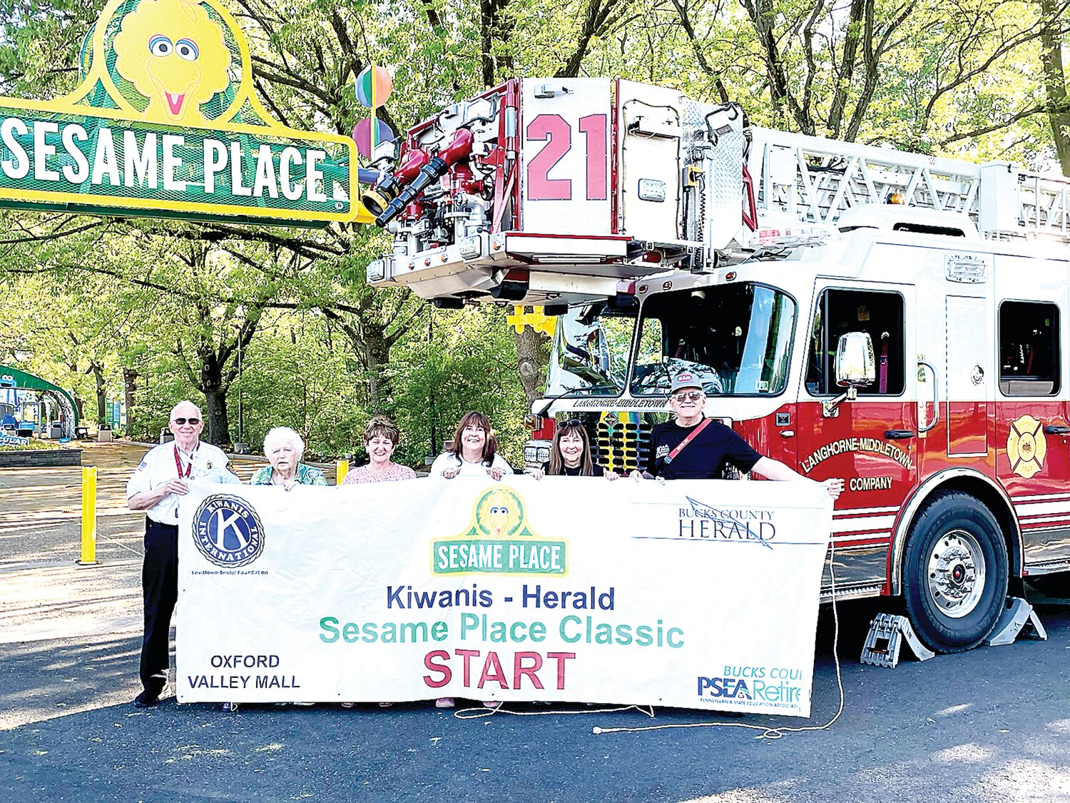Getting ready for the 2024 Kiwanis-Herald Sesame Place Classic races on May 19 are, from left, Langhorne-Middletown Fire Police Capt. Larry Harvey, Levittown-Bristol Kiwanis Club members Dixie Rhodes, Donna Milner, Debbi Glass and kids’ sprint coordinators Rose and Steve McIver.