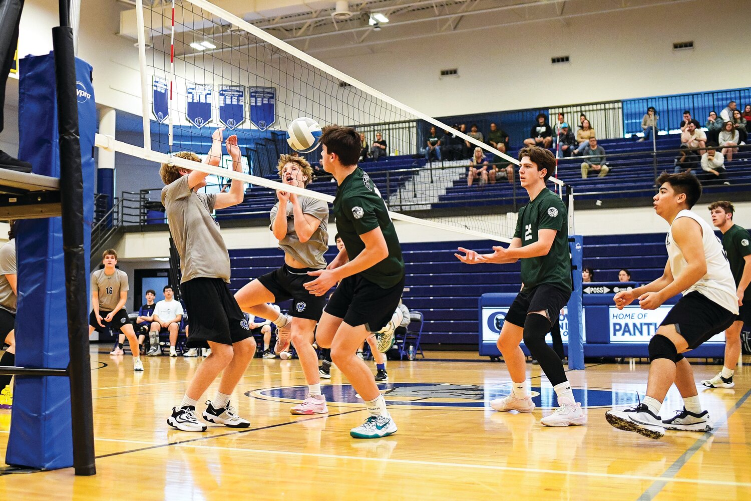 Quakertown’s Sean Gillin and Miles Longacre block the spike attempt of Pennridge’s Logan Jalosinski.