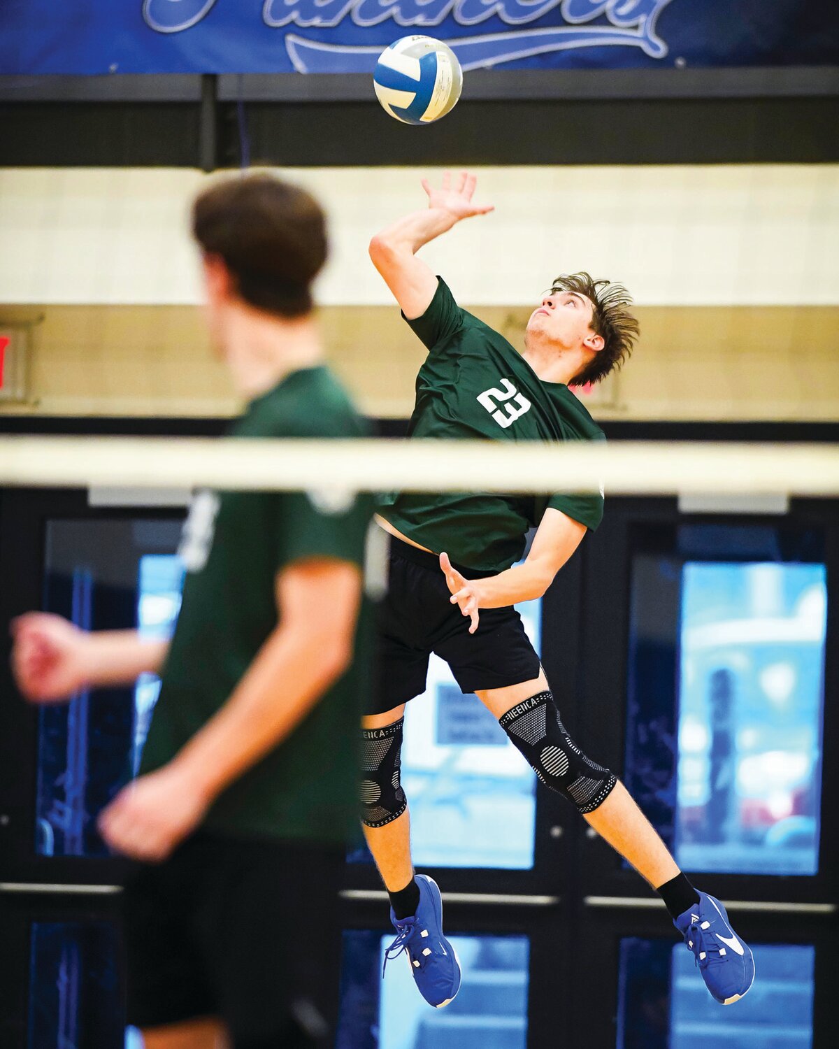 Pennridge’s Aaron Ladd serving during the first game.