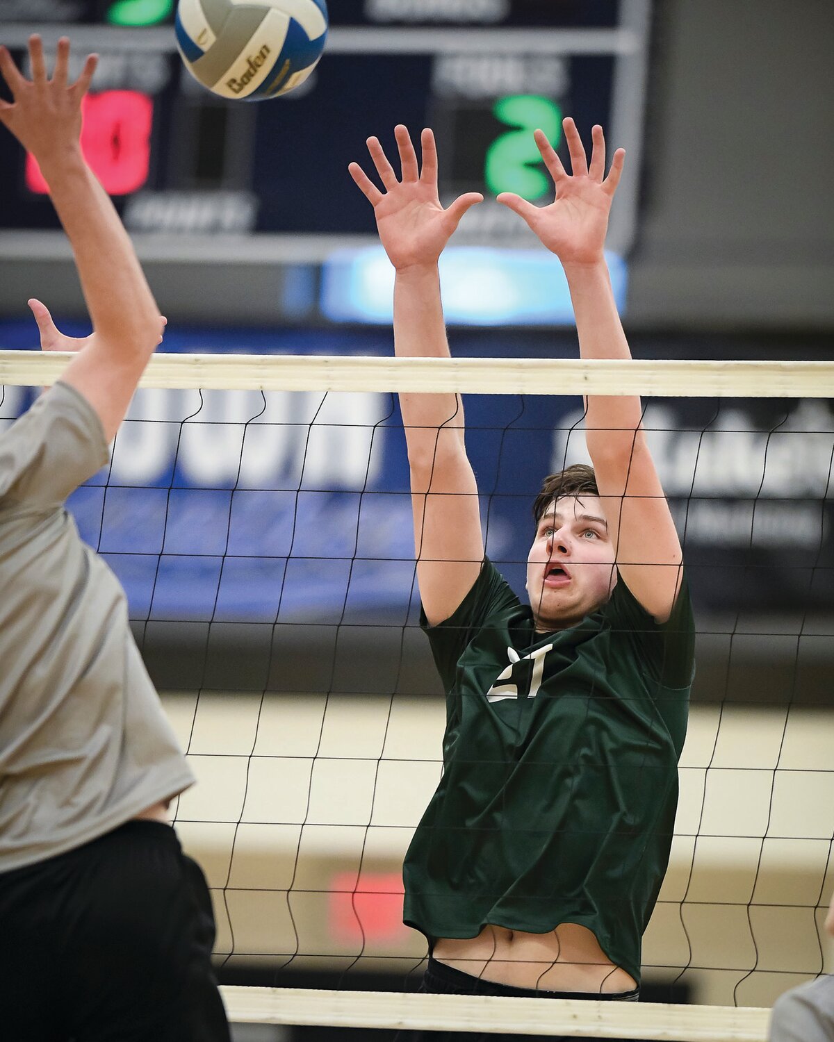 Pennridge’s Logan Jalosinski goes up for a block attempt against Quakertown’s James Conner.