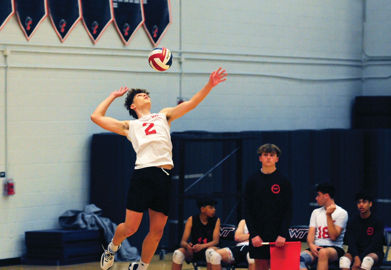 William Tennent’s Eric Korchuk serves up a ball in the Panthers’ recent Suburban One League matchup with Pennsbury.