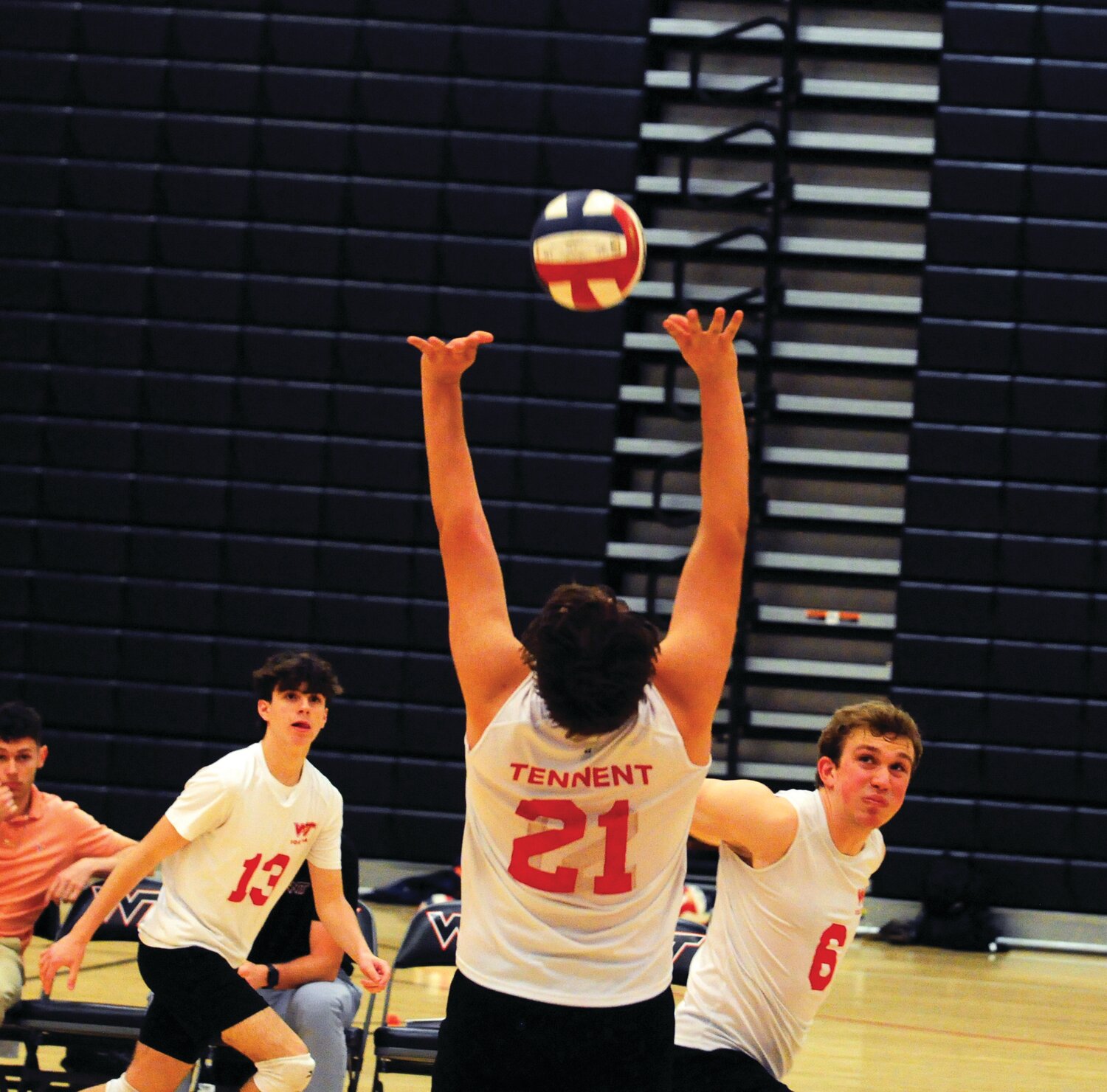 William Tennent’s Tristan Ziegler, 21, center, sets the ball in the Panthers’ recent Suburban One League matchup with Pennsbury. A.J. Cutillo, left, and Edwin Lurie, right, get set for the kill.
