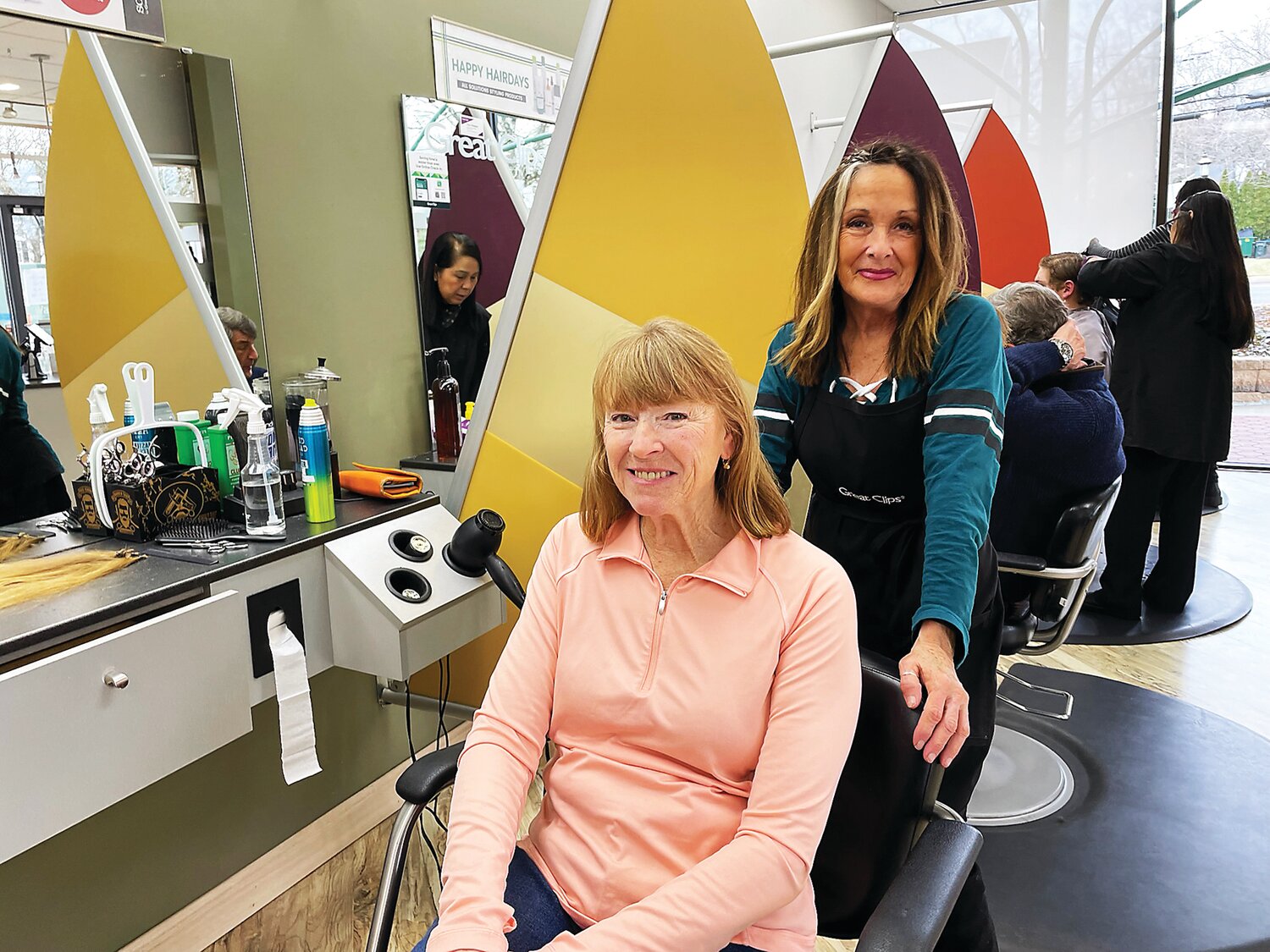 Jane Jones, seated, recently donated 13 inches of hair to Wigs for Kids, which serves children experiencing hair loss.