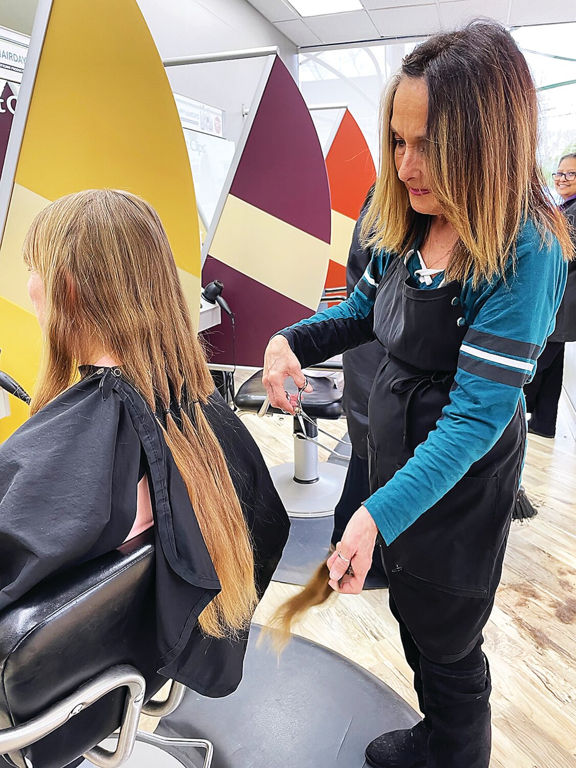 After growing out her hair for several years, Jane Jones had 13 inches cut off on Dec. 31, 2023, at Great Clips in Doylestown. She sent her locks to Wigs for Kids – her third hair donation to the nonprofit organization since 2016.