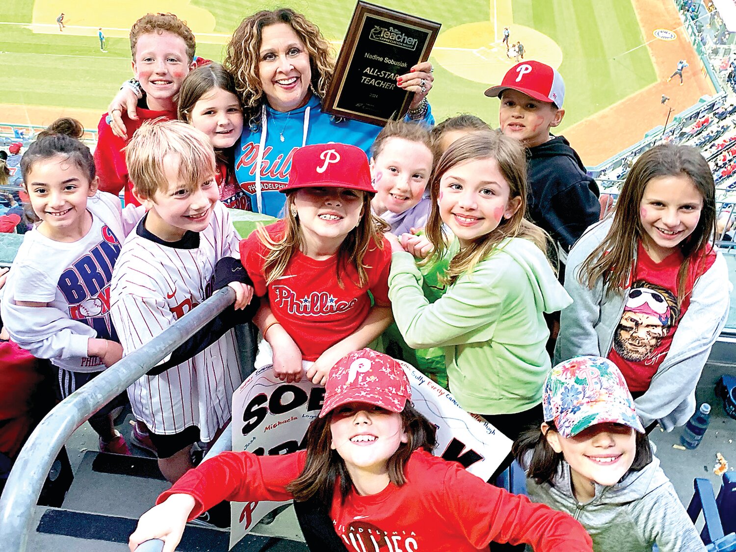 Nadine Sobusiak joins cheering students at the Phillies’ Teacher Appreciation Night May 3.