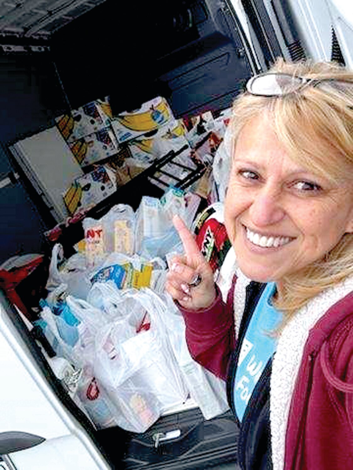 Melody Latare of Warminster Food Bank helps load the truck with groceries donated by Giant Supermarket of Warminster customers and members of the community on Saturday, April 13.