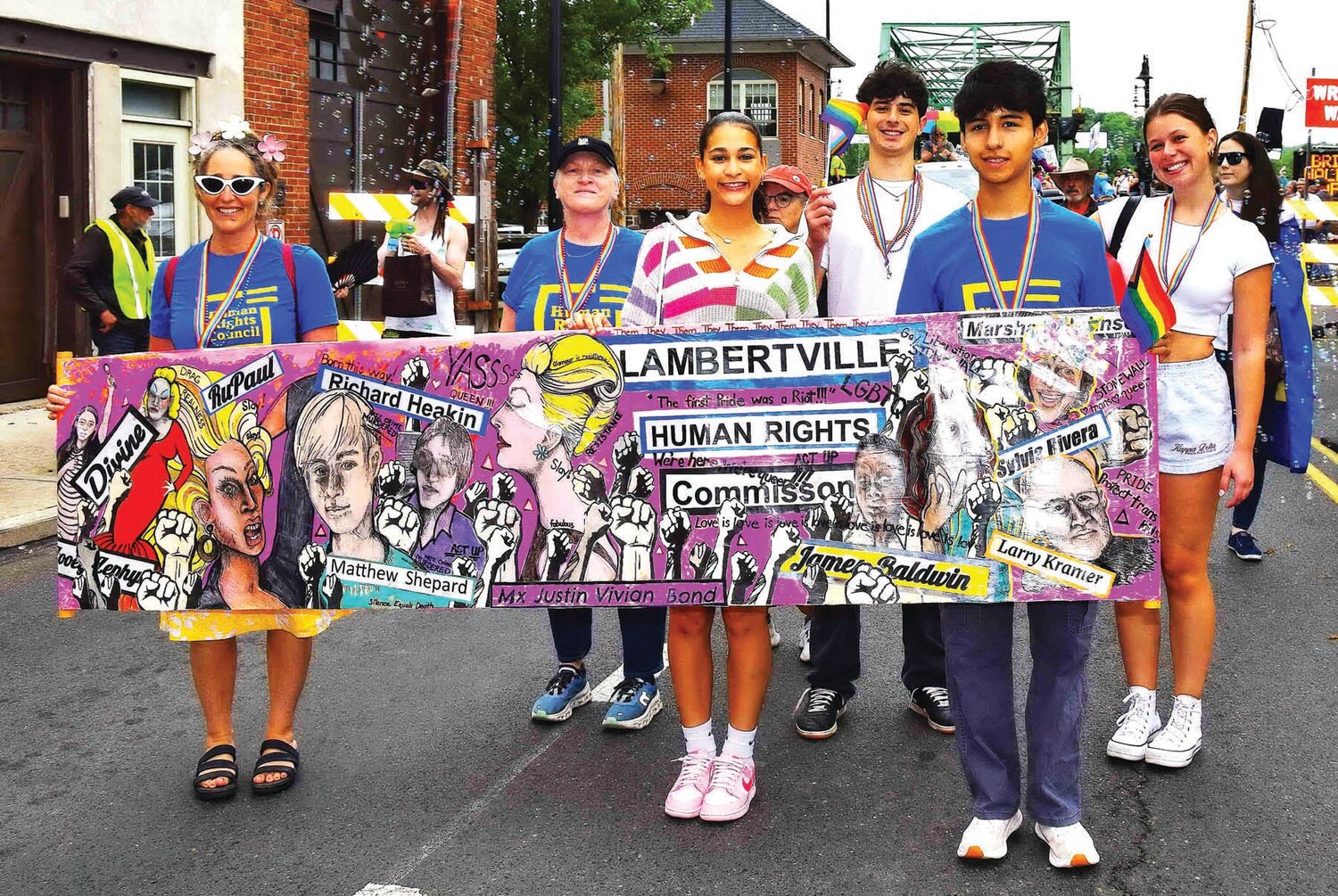 Participants pause for a moment along the Pride Parade route.