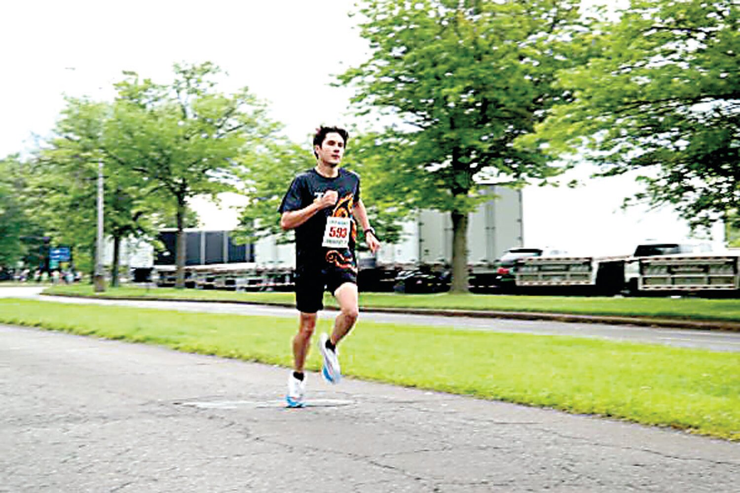 Christopher Baisden, 19, of Bensalem runs on his way to an overall second-place finish (17:20) in Sunday’s 24th annual Kiwanis-Herald Sesame Place Classic 5K in Langhorne.