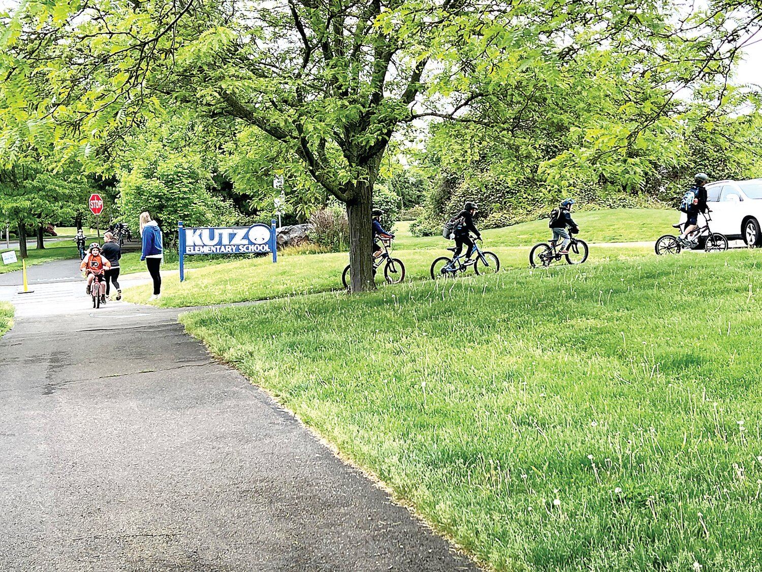 Students participate in a bike ride that started at the Doylestown Township municipal building and traveled through Central Park and ended at the elementary school.